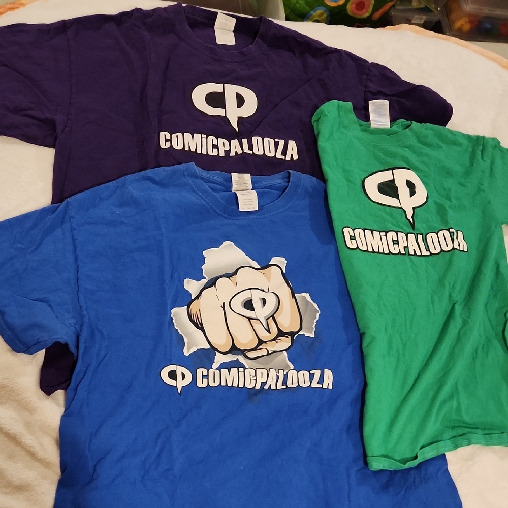 Comicpalooza Staff and Volunteer shirts from various years
